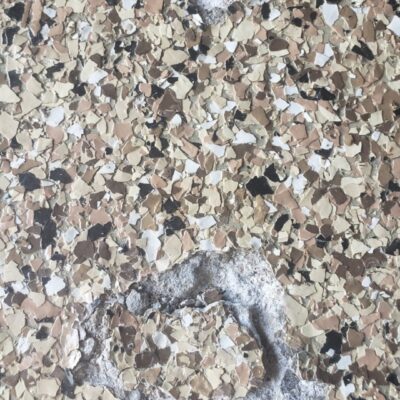 Garage floor with speckled epoxy coating, flooring warranty registration example.